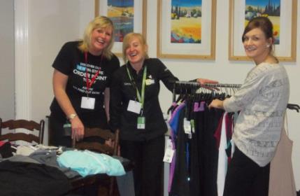 Occupational Therapist, Rebecca Gould, helping staff from George prepare the first 'Pop Up Shop'
