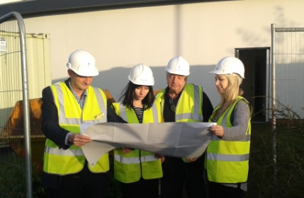 Hospital Manager Mark Varney and members of the Derby team study the plans for the new flatlets