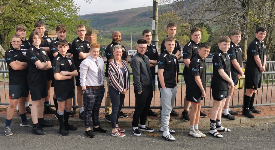 Staff and service users from Cygnet St Teilo House with members of the Abertysswg Falcons RFC team