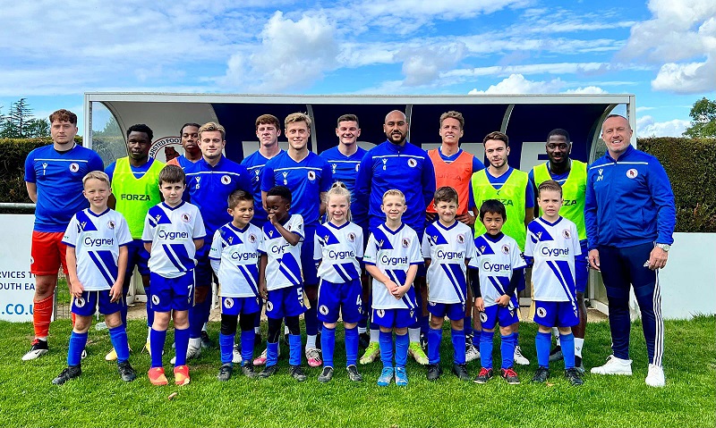 The Bear Cubs with members of the Bearsted FC first team