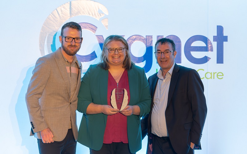 Sally Whittle-Long presented with her award by JJ Chalmers and Peter Smith