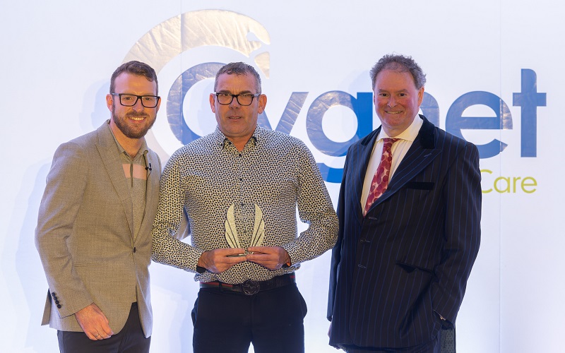 Ali Down receiving his award from JJ Chalmers and Mark Stephens CBE