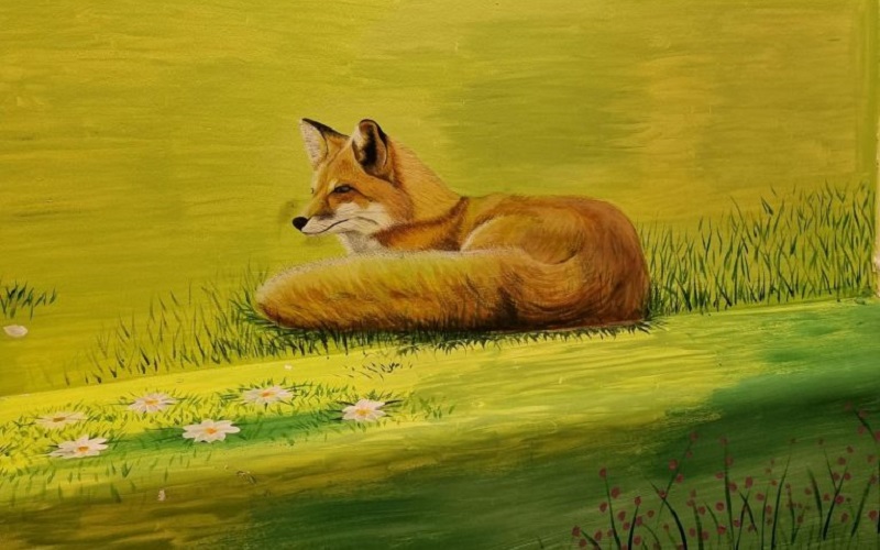 A fox is part of the larger mural