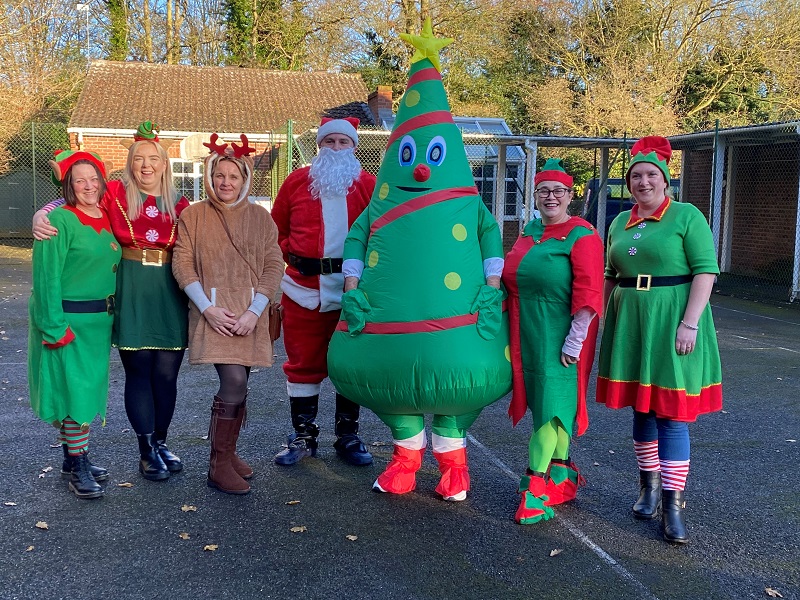 Staff members dressed up at the Christmas market