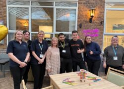 The Fields team along with experts by experience at the new social hub at The Fields