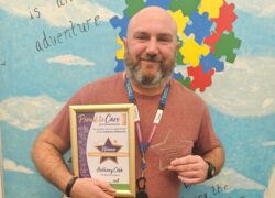 Activity Co-ordinator Anthony Cobb, with his Champion of Activities and Wellbeing Award