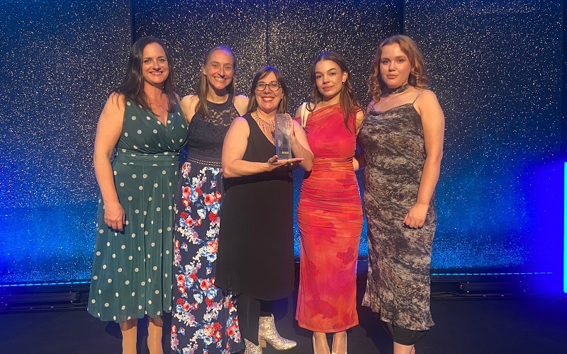 Cygnet's Comms team accepting the award