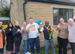 Beckly staff and some of the people they support celebrating their CQC rating