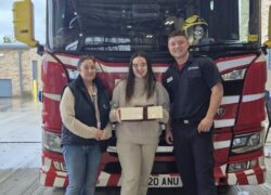 Cygnet Nield House patient and staff member delivering cakes to the local fire service.
