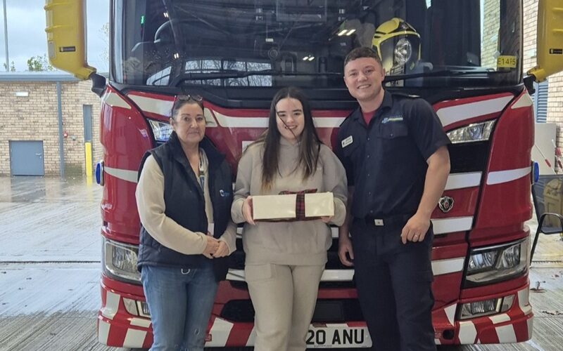 Cygnet Nield House patient and staff member delivering cakes to the local fire service.