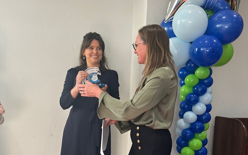 Dulcie receiving her award