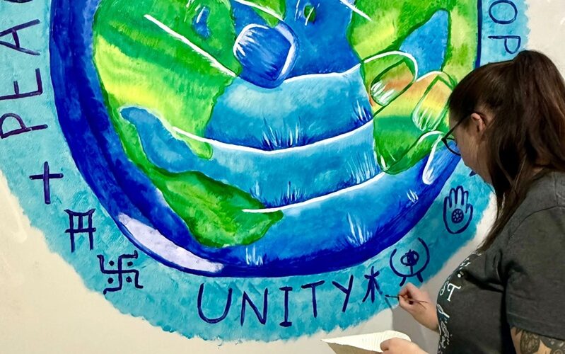 Heidi working on the mural at Cygnet Hospital Bierley