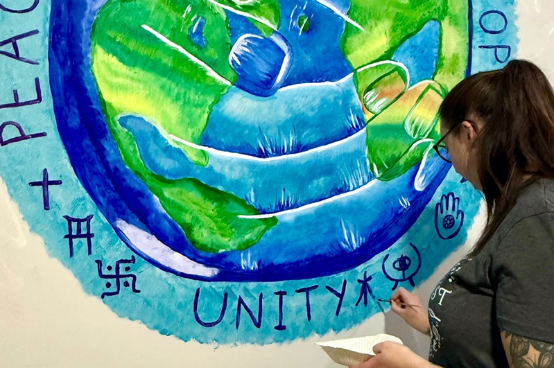 Heidi working on the mural at Cygnet Hospital Bierley