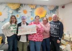 Staff and patients from Cygnet Maple House presenting a cheque to 4Louis