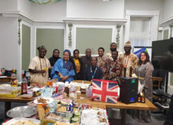A diverse group of staff, patients and community partners at Cygnet Hospital Wyke celebrating Culture Day, with traditional dress, cultural food and shared displays representing different backgrounds.