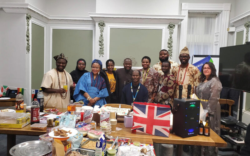 A diverse group of staff, patients and community partners at Cygnet Hospital Wyke celebrating Culture Day, with traditional dress, cultural food and shared displays representing different backgrounds.