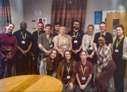 Staff from Cygnet Pindar House standing together indoors to celebrate receiving a ‘Good’ rating from Headway