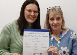 Cygnet Hospital Derby's Carol Collins and Emily Rowlandson-Gray and the Dignity Achievement certificate