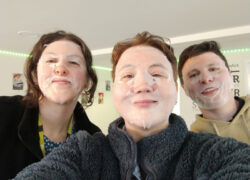 Three members of the Cygnet Sherwood House team pose in a selfie wearing full facial skincare masks