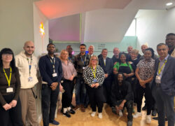 The team at Cygnet Hospital Stevenage involved in creating the social hub smiling in the renovated space