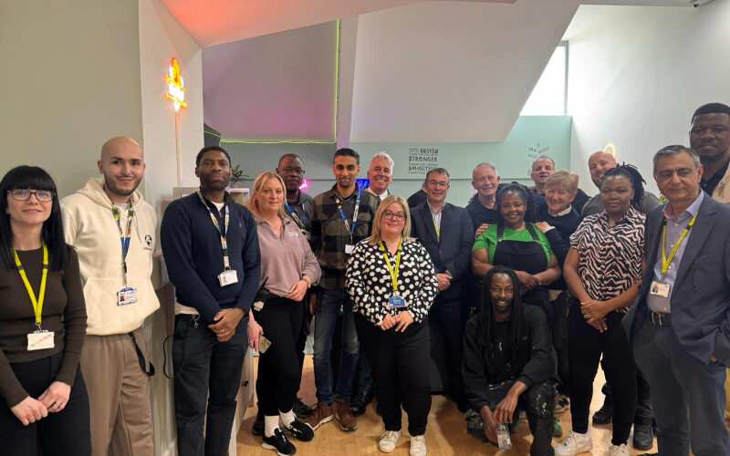 The team at Cygnet Hospital Stevenage involved in creating the social hub smiling in the renovated space