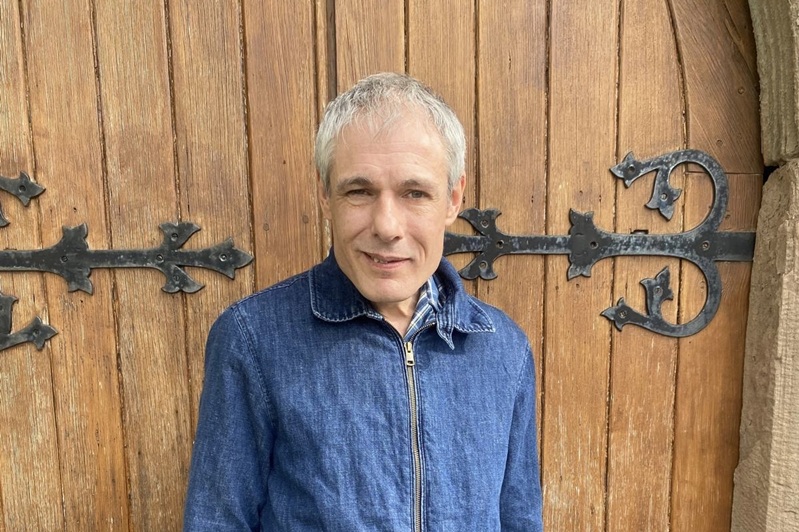 Michael by the entrance to All Saints Church in Blakeney