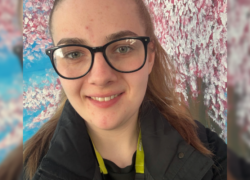 Support Worker Tegan Hutchinson smiling at the camera