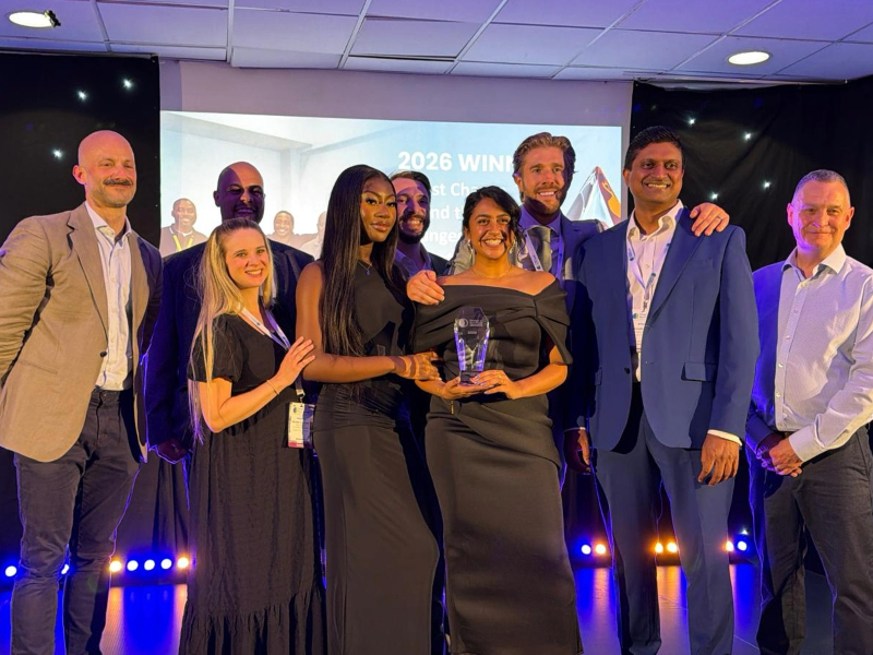 The Cygnet Hospital Harrow team smiling on stage collecting their award
