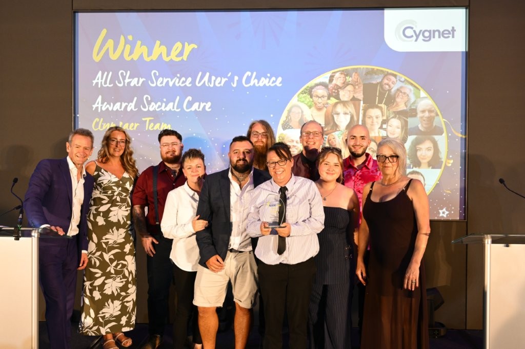 The winners of the All Star Service User’s Choice Award on stage with Head of HR Jenny Gibson and celebrity host Alexander Armstrong