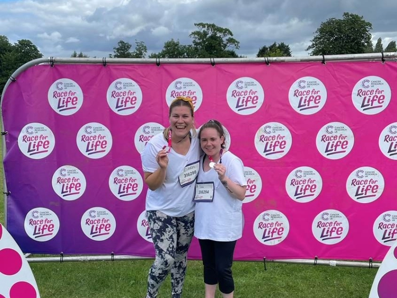 Two ladies from Hawkstone holding their medals after the race