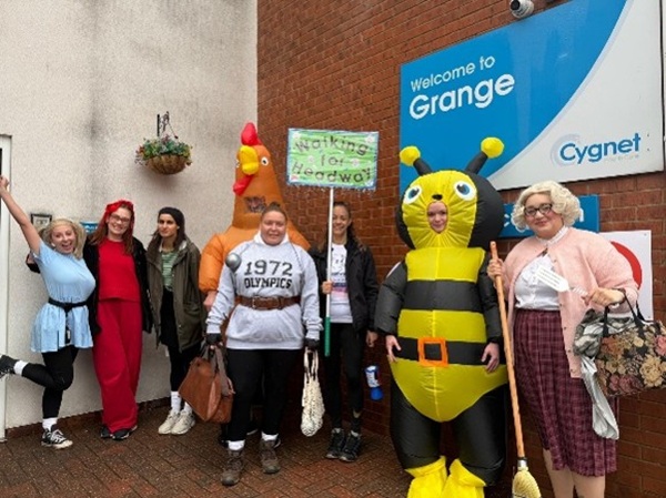 The team at Cygnet Grange and Cygnet Lodge in fancy dress, including Miss Trunchbull, Mrs Doubtfire and an inflatable chicken