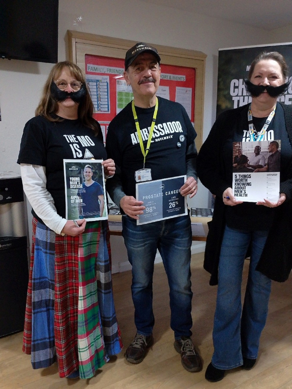 Mike with colleagues at Cygnet Hospital Woking wearing fake moustaches for Movember
