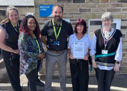 Team members at Cygnet Lodge Brighouse with their Triangle of Care certificate
