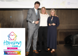 The Fields team collect the award on stage at the Housing with Care awards