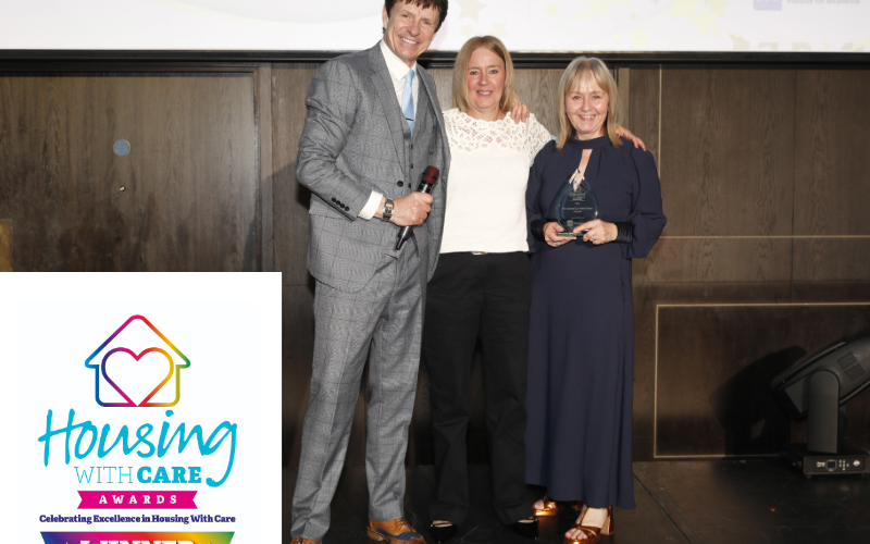 The Fields team collect the award on stage at the Housing with Care awards