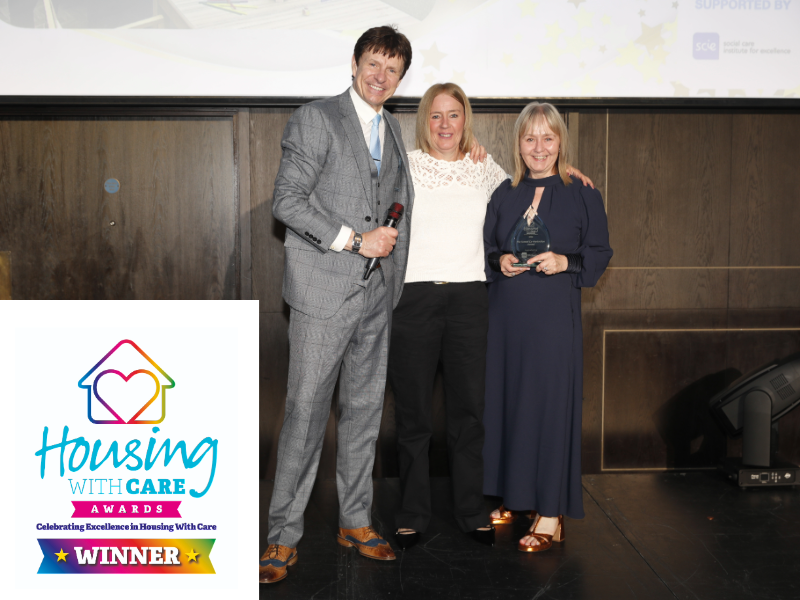 The Fields team collect the award on stage at the Housing with Care awards