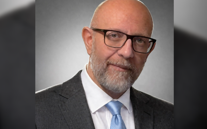 Headshot of Dr Salim Matta in a suit