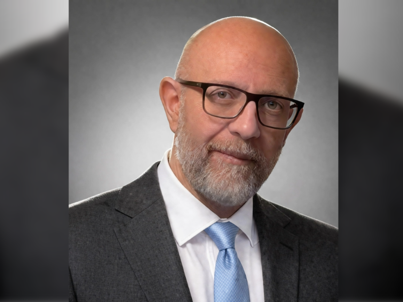 Headshot of Dr Salim Matta in a suit