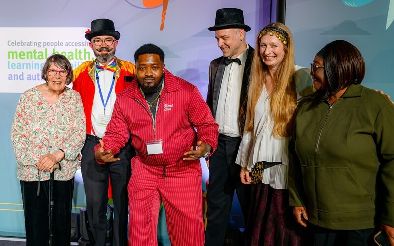 Akin on the stage at National Lived Experience Awards