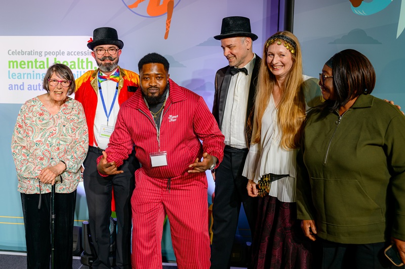 Akin on the stage at National Lived Experience Awards